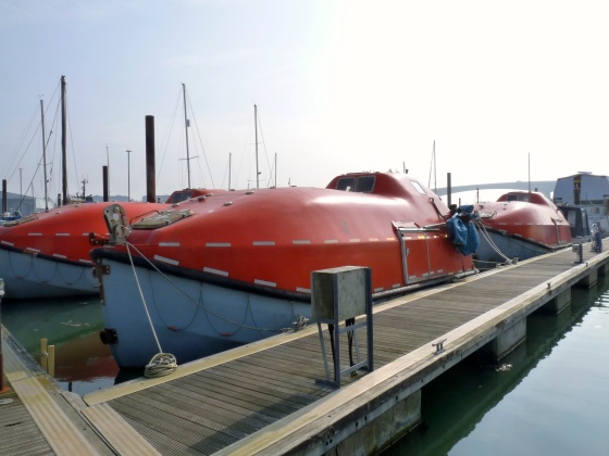 These were once ship lifeboats that were sold off for scrap. Six do-it-yourselfers snapped them up to be convert them into homes for themselves. 